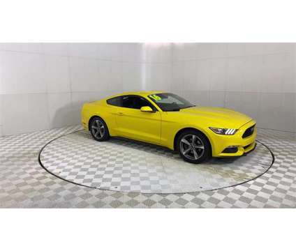 2016 Ford Mustang V6 is a Yellow 2016 Ford Mustang V6 Coupe in Southfield MI