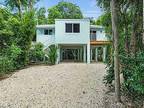Beautiful Stilt built home on a corner lot and surrounded by mature trees for