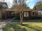 Two-bedroom, one-bath, one-story, 1,252 sq ft brick home attached