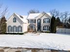 Discover the allure of this charming 5 bed/3.5 bath Colonial