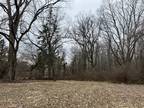 2.5 Acre Tree-Filled Lot on the North Side
