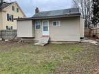 Nice little porch on the front of the home, privacy fence