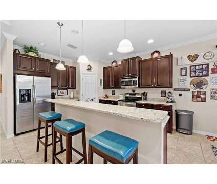 Gated community, Community pool at 12880 Seaside Key Ct in Fort Myers FL is a Single-Family Home