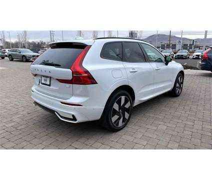 2024 Volvo XC60 Recharge Plug-In Hybrid Plus Dark Theme is a White 2024 Volvo XC60 3.2 Trim Hybrid in Reno NV