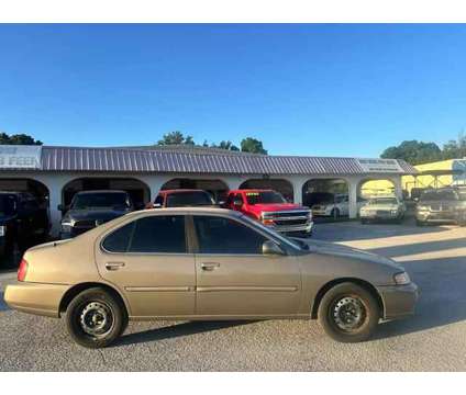 2000 Nissan Altima for sale is a Brown 2000 Nissan Altima 2.5 Trim Car for Sale in Haines City FL