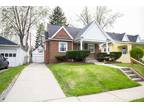 An Adorable 2BR Brick Home with Original Hardwoods, Custom Bath, Full Baseme.