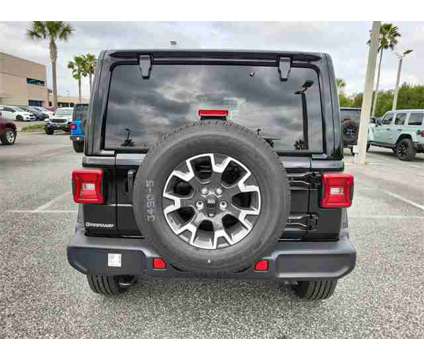 2024 Jeep Wrangler Sahara is a Black 2024 Jeep Wrangler Sahara Car for Sale in Orlando FL
