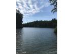 Shelby, Peaceful wooded 1.69-acre lot on small private lake.