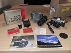 Canon AE-1 Program SLR 35mm Camera With Manual, Extra Lens, Flasher, And More