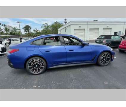 2024 BMW i4 xDrive40 is a Blue 2024 Sedan in Jacksonville FL