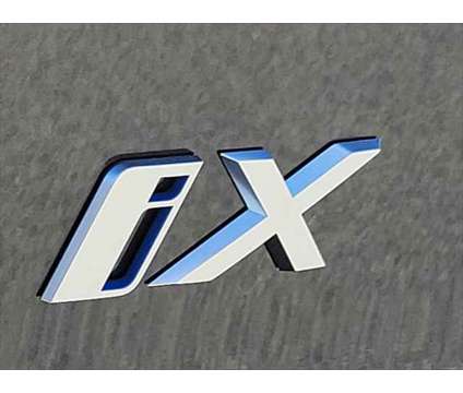 2024 BMW iX xDrive50 is a Grey 2024 BMW 325 Model iX SUV in Newton NJ
