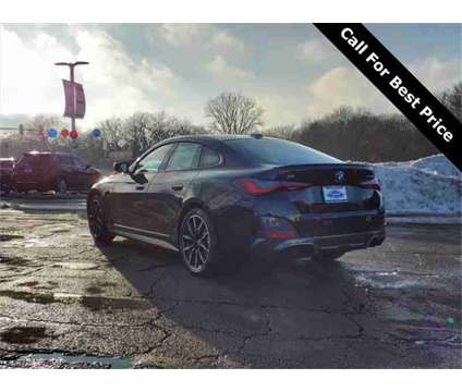 2024 BMW i4 is a Black 2024 Hatchback in Rockford IL