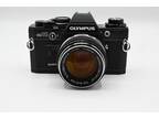Olympus OM-10 Manual Camera in Chrome or Black + Optional 50mm f/1.4 OM Lens
