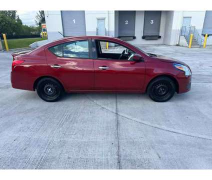 2017 Nissan Versa for sale is a Red 2017 Nissan Versa 1.6 Trim Car for Sale in North Lauderdale FL