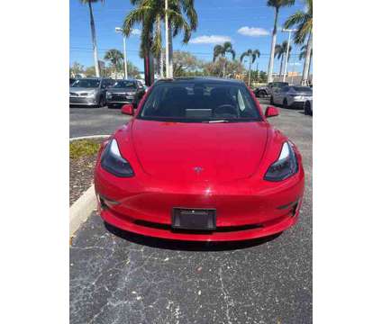 2023 Tesla Model 3 Base is a Red 2023 Tesla Model 3 Sedan in Fort Myers FL