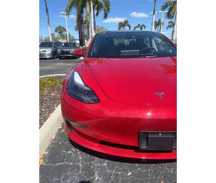2023 Tesla Model 3 Base is a Red 2023 Tesla Model 3 Sedan in Fort Myers FL