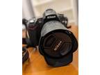 Nikon D D90 12.3MP Digital SLR Camera - Black (Kit w/ VR 18-105 mm Lens) & Cover