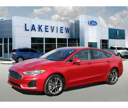 2020 Ford Fusion SEL is a Red 2020 Ford Fusion SEL Sedan in Battle Creek MI