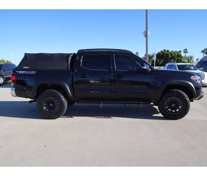 2018 Toyota Tacoma TRD OFF ROAD MANUAL 6 SPEED 4X4 V6 is a Black 2018 Toyota Tacoma TRD Off Road Truck in Oxnard CA