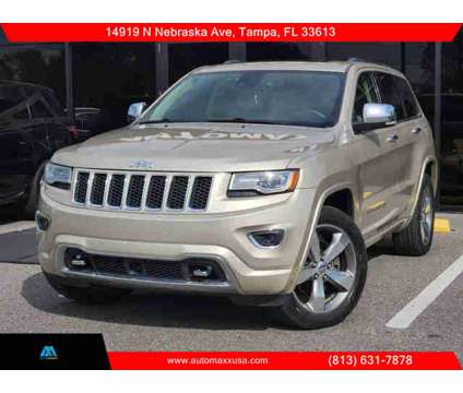 2014 Jeep Grand Cherokee for sale is a Tan 2014 Jeep grand cherokee Car for Sale in Tampa FL