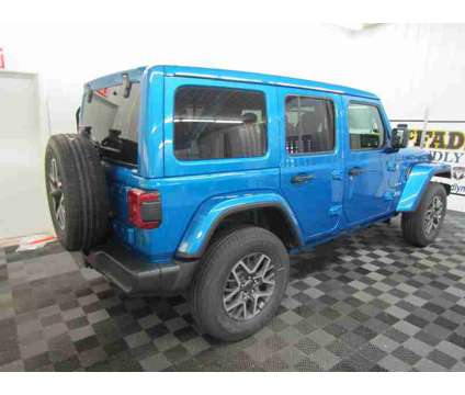 2024 Jeep Wrangler Sahara is a Blue 2024 Jeep Wrangler Sahara SUV in South Haven MI