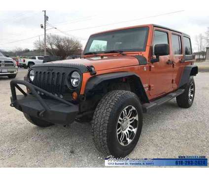 2011 Jeep Wrangler Unlimited Sport is a Yellow 2011 Jeep Wrangler Unlimited SUV in Vandalia IL