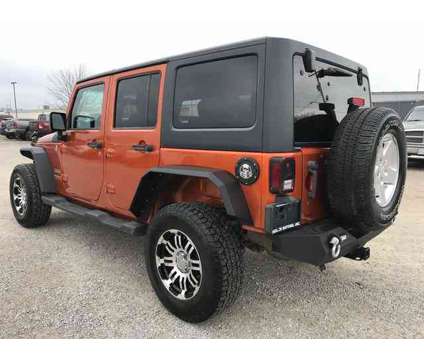 2011 Jeep Wrangler Unlimited Sport is a Yellow 2011 Jeep Wrangler Unlimited SUV in Vandalia IL