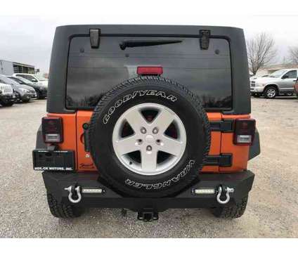 2011 Jeep Wrangler Unlimited Sport is a Yellow 2011 Jeep Wrangler Unlimited SUV in Vandalia IL