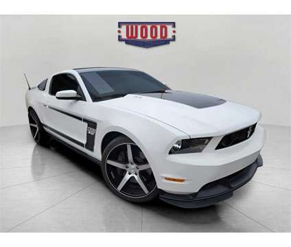 2012 Ford Mustang Boss 302 is a White 2012 Ford Mustang Boss 302 Coupe in Harrison AR