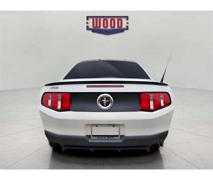 2012 Ford Mustang Boss 302 is a White 2012 Ford Mustang Boss 302 Coupe in Harrison AR