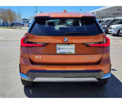 2024 BMW X1 xDrive28i is a Orange 2024 BMW X1 xDrive 28i SUV in Loveland CO