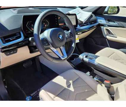 2024 BMW X1 xDrive28i is a Orange 2024 BMW X1 xDrive 28i SUV in Loveland CO