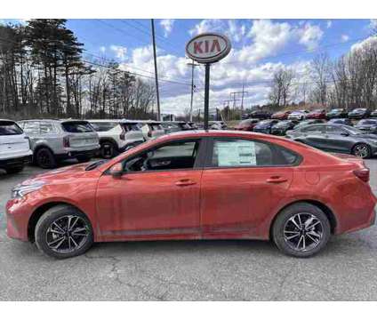 2024 Kia Forte LXS is a Orange 2024 Kia Forte Sedan in Queensbury NY