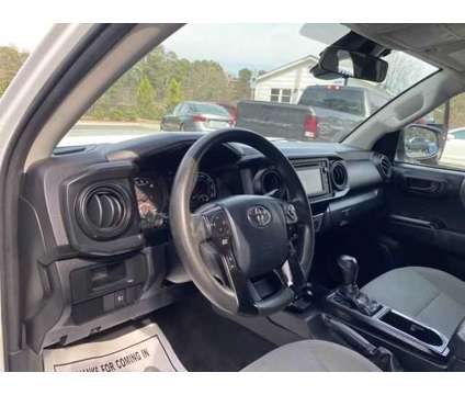 2018 Toyota Tacoma SR5 is a White 2018 Toyota Tacoma SR5 Truck in Cary NC