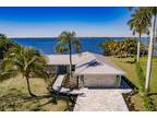 RIVERFRONT! Fully renovated home with an amazing mile-long water view.