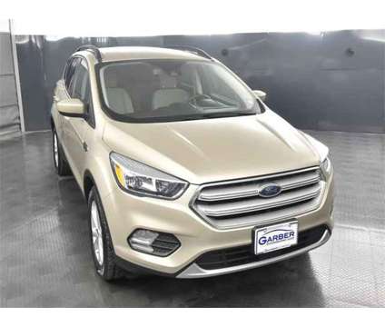 2018 Ford Escape SE is a Gold, White 2018 Ford Escape SE SUV in Rochester NY