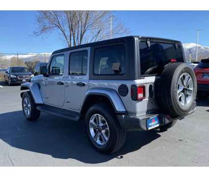 2020 Jeep Wrangler Unlimited Sahara 4X4 is a Silver 2020 Jeep Wrangler Unlimited Sahara SUV in Woods Cross UT