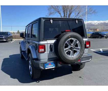 2020 Jeep Wrangler Unlimited Sahara 4X4 is a Silver 2020 Jeep Wrangler Unlimited Sahara SUV in Woods Cross UT