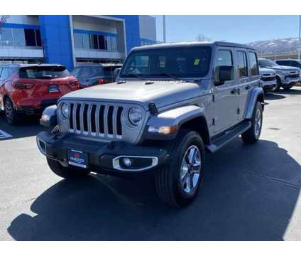 2020 Jeep Wrangler Unlimited Sahara 4X4 is a Silver 2020 Jeep Wrangler Unlimited Sahara SUV in Woods Cross UT