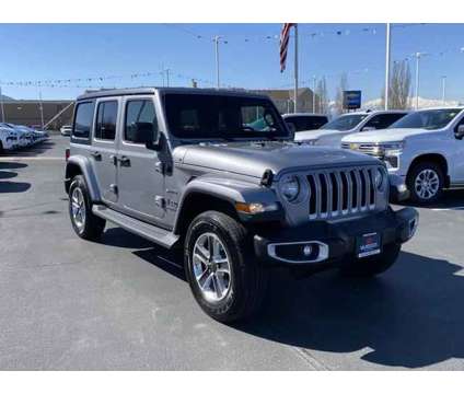 2020 Jeep Wrangler Unlimited Sahara 4X4 is a Silver 2020 Jeep Wrangler Unlimited Sahara SUV in Woods Cross UT