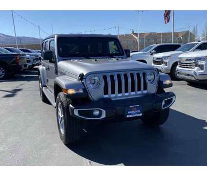 2020 Jeep Wrangler Unlimited Sahara 4X4 is a Silver 2020 Jeep Wrangler Unlimited Sahara SUV in Woods Cross UT