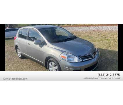 2011 Nissan Versa for sale is a Grey 2011 Nissan Versa 1.6 Trim Car for Sale in Haines City FL