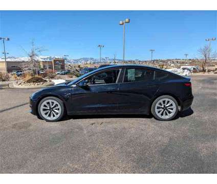 2021 Tesla Model 3 Standard Range Plus is a Black 2021 Tesla Model 3 Sedan in Colorado Springs CO