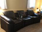 Black leather reclining sofa