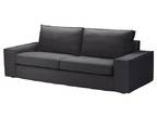 Black sofa and matching footstool (Ottoman)