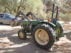 john deere 950S tractor and 2500 gallon water tank