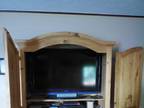 Entertainment Center holds an 42" and 30 inch high flat screen.