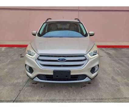 2018 Ford Escape for sale is a Tan 2018 Ford Escape Car for Sale in Houston TX