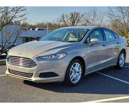 2015 Ford Fusion SE is a Brown 2015 Ford Fusion SE Car for Sale in Sellersville PA