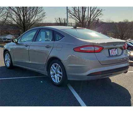 2015 Ford Fusion SE is a Brown 2015 Ford Fusion SE Car for Sale in Sellersville PA